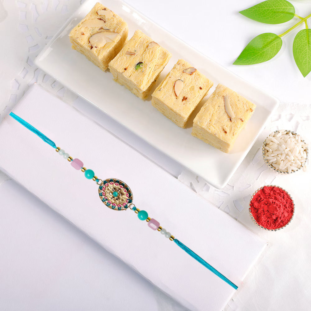 Golden Bloom Designer Rakhi Combo with Desi Ghee Laddoo, Soan Papdi & Kaju Katli 200 gm